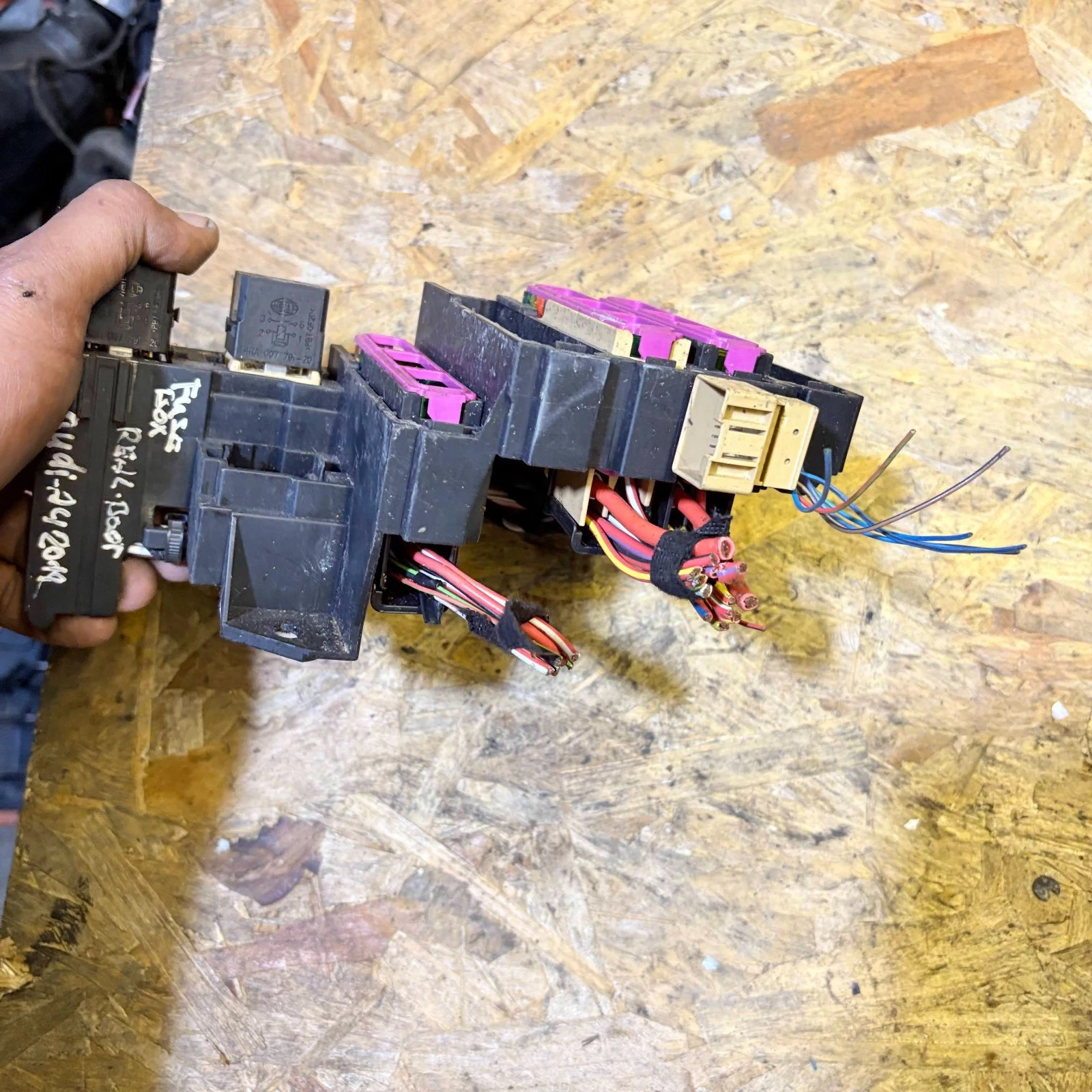 Actual Audi A4 rear fuse carrier showing connectors and cut wiring