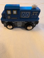 Imaginarium wooden train engine featuring a dark blue cab and detailed silver gr
