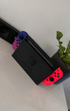 Nintendo Switch OLED Konsole mit Spielen und Lenkräder
