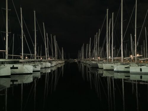 Docked sailboats at night - Picture 1 of 1