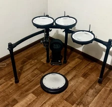 Roland TD17 (-module) VH10 (-clutch) drum rack, PDX8 toms (3), PDX12 snare, KD10