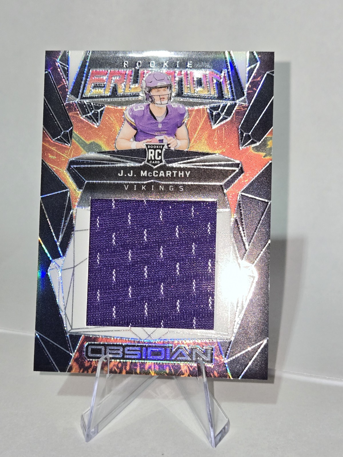 JJ McCarthy Panini Obsidian Rookie Eruption Materials #ERMJMY Base