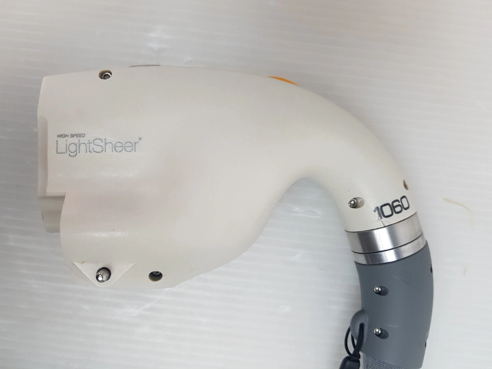 Side view of the handpiece body with HIGH SPEED LightSheer logo and 1060 marking