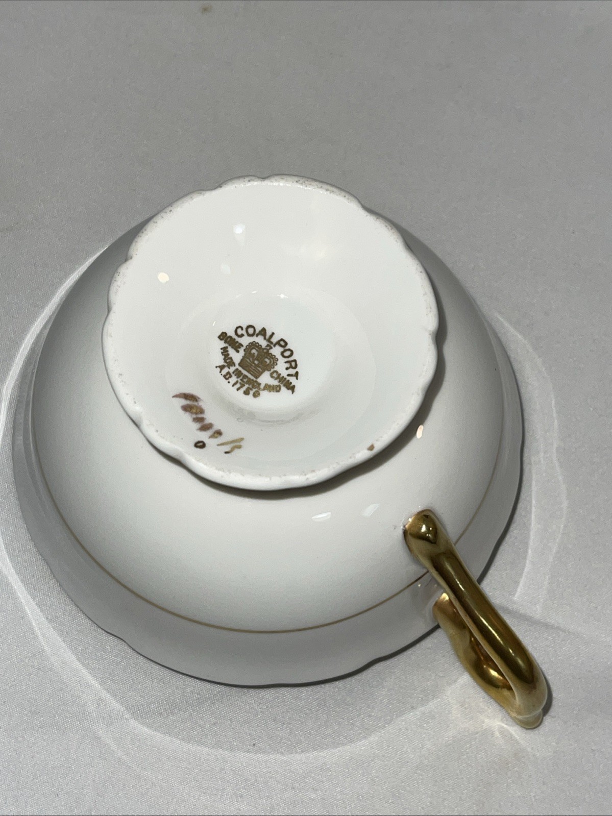 Coalport tea cup and saucer Black And Gold Floral Design. Footed. ￼