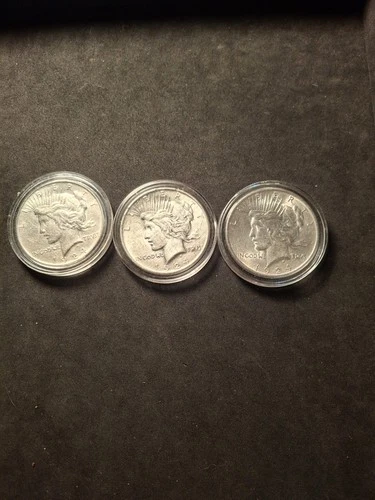 3x1924 almost uncirculated silver peace dollars.90% silver.