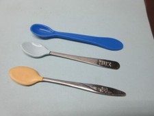 3 baby feeding spoons - 2 silicon tipped and 1 plastic - 1 is a NUK