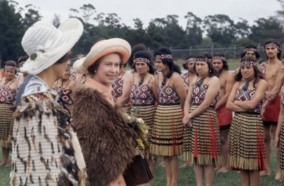 Queen Elizabeth II is greeted by a group of people Maori dress duri- Old Photo