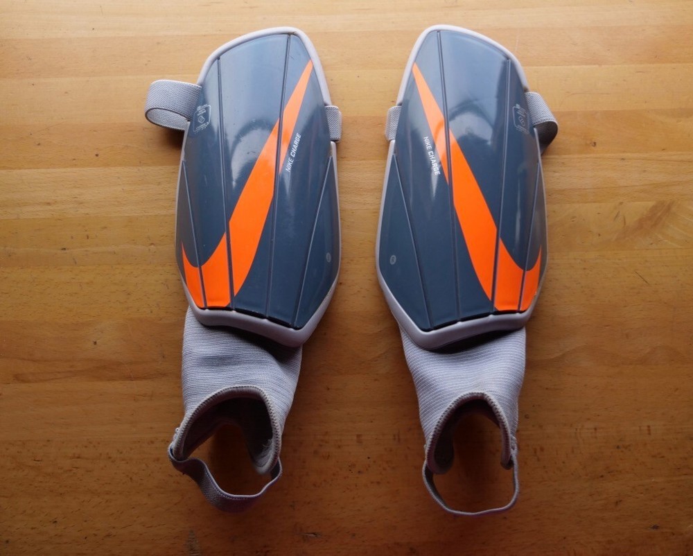 Nike Charge Adult Large Shin Guard SP2164-490 in Grey Orange and Gray