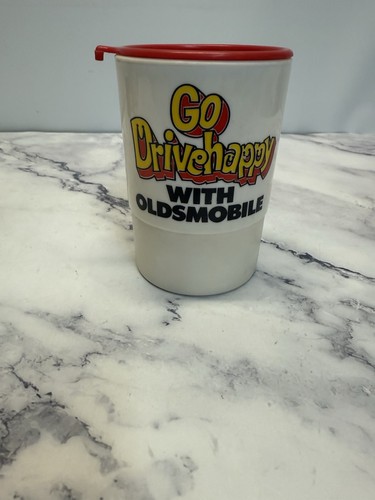 vintage whirley travel mug Go Drive Happy With Oldsmobile Advertisement