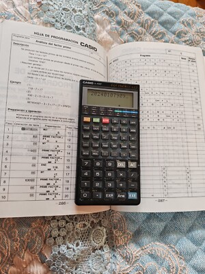 Vintage CASIO FX-4500P calculator with manual in good condition