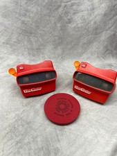 2 Viewmaster viewers and assortment of Disney random rounds with case
