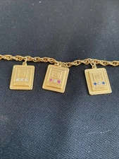 VTG 1/10 10k General Motors GM Anniversary 7”  Three Charm Bracelet  Goldtone