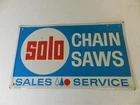 VINTAGE ADVERTISING SIGN- SOLO CHAIN SAWS METAL ADVERTISING SIGN- STOUT SIGN CO.