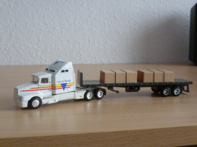 ERTL Collectibles 4265 - KENWORTH T600B mit Flatbed Trailer und Ladung
