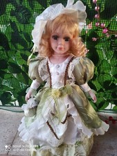 Bambola da collezione in porcellana NJSF Damina  con borsetta h 40 pari a nuova 