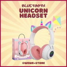 White color with touch of pink unicorn headphones either lights, size adjustable