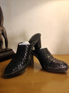 black woven leather mules