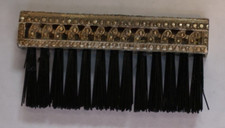 Vintage Decorative Lint Clothing Brush with ornate metal top.