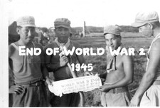 B W Photo Soldiers holding Newspaper End of WW 2 -1945