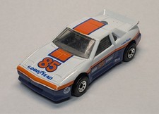 Matchbox Pontiac Fiero White 1985 Goodyear Made in Macau 1:56 Scale