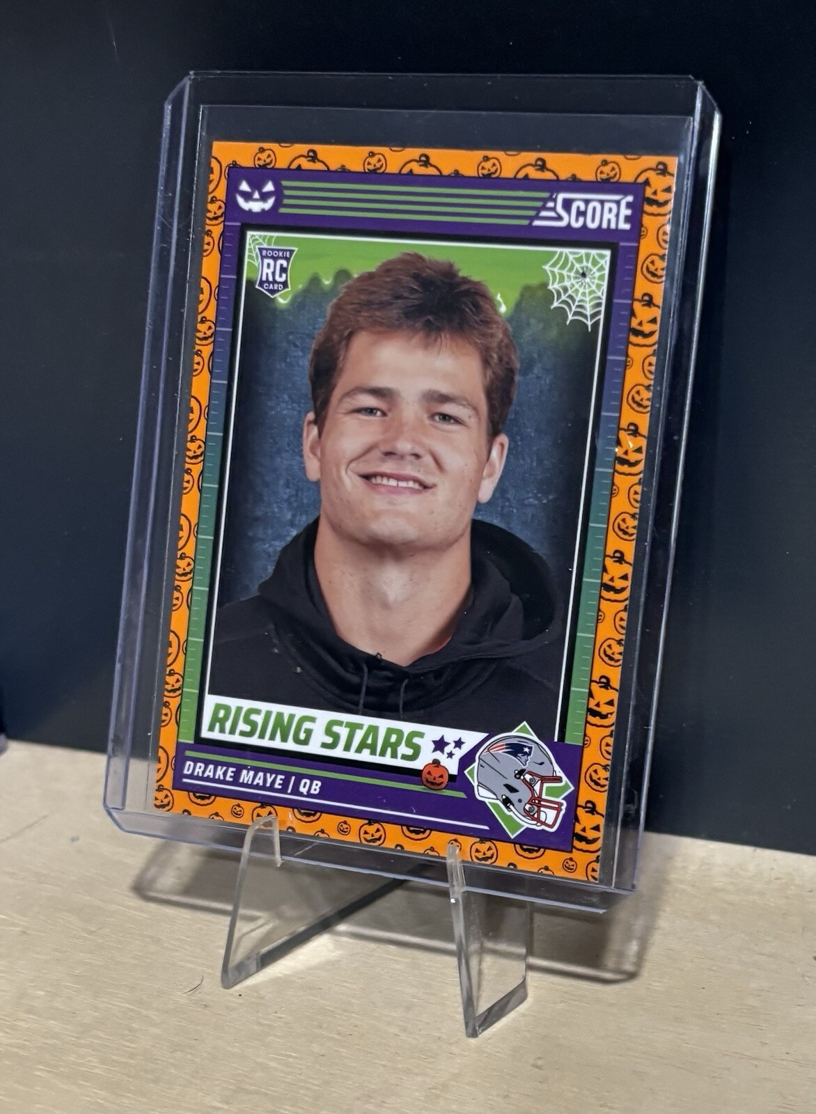 2024 Panini - Score a Treat Orange Pumpkin Drake Maye Rising Stars #17 (RC)