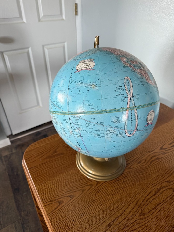 A vintage George F. Cram Imperial World Globe on a metal stand — a classic cartographic artifact from a legendary American map publisher for just $20.