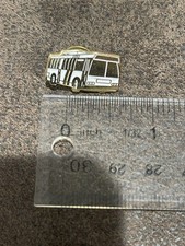vintage lapel pin depicting a General Motors (GM) RTS (Rapid Transit Series) bus