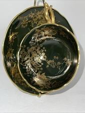 Coalport tea cup and saucer Black And Gold Floral Design. Footed. ￼