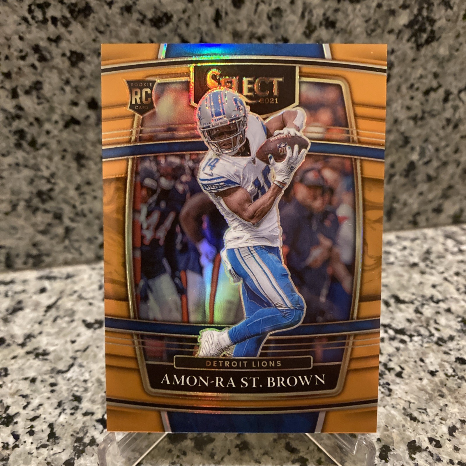 Amon-Ra St. Brown 2021 Panini Select #73 Concourse Orange Prizm 21/49 RC Lions