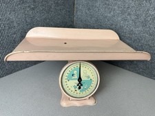 Vintage 1950s pink metal nursery baby scale with mid-century illustrations. 30lb