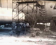 Vintage photo of a group of Soviet Army soldiers near an airplane.