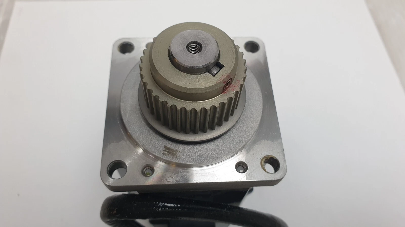 Flange end of the Mitsubishi HC-KFS23K with a timing pulley on the keyed shaft