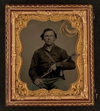 Unidentified soldier in Union uniform with sword, with lock of hair in case