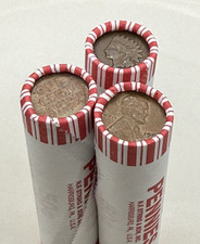 INDIAN HEAD CENT showing on one end of old unsearched white us wheat penny roll