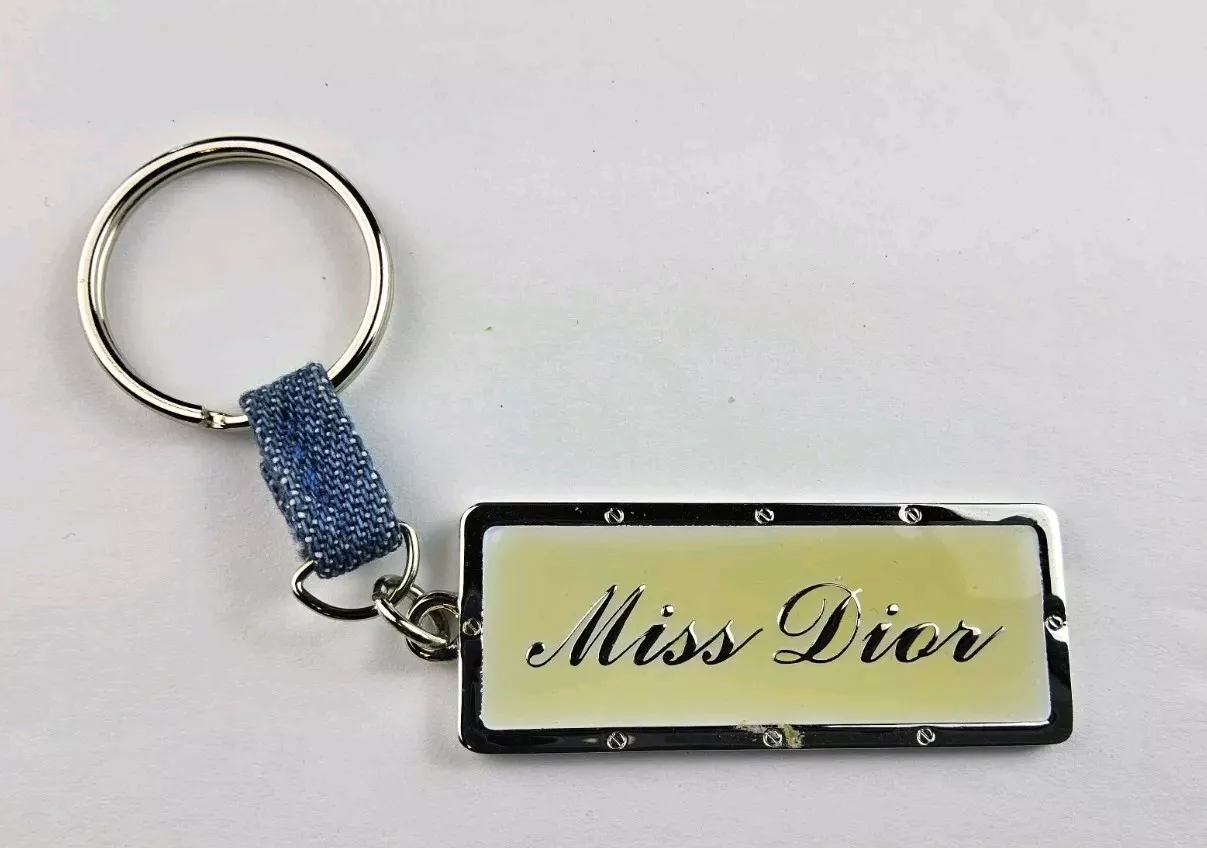 Porte clés Christian Dior ton argent porte breloque sac