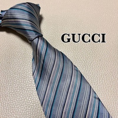 Gucci Krawatte, GG Muster, gestreift, gepunktet, kariert, Farbe grau.