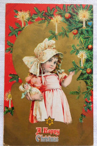 Antique Christmas greeting postcard  c1910~ Girl in pink dress holding doll