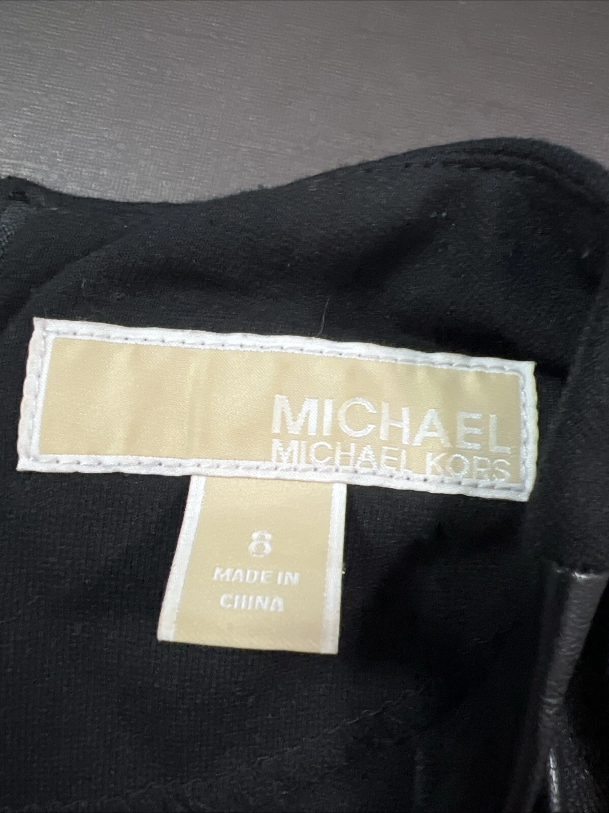 Abito donna Michael Kors piccolo nero pelle di agnello manica lunga zip tasche Italia