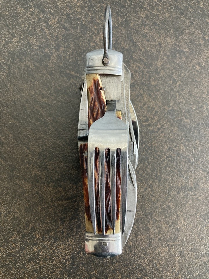 A vintage Japanese hobo/camping multi-tool with fork, spoon, and blade folded into one — a rare, whimsical piece of mid-century survival ingenuity.