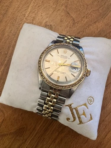 Vintage 1969 rolex oyster perpetual datejust with aftermarket diamond bezel.