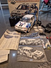 Tamiya RS Cosworth Escourt Tiger Rc Auto.  Brillante Kultige. Verpackt mit Handbuch.