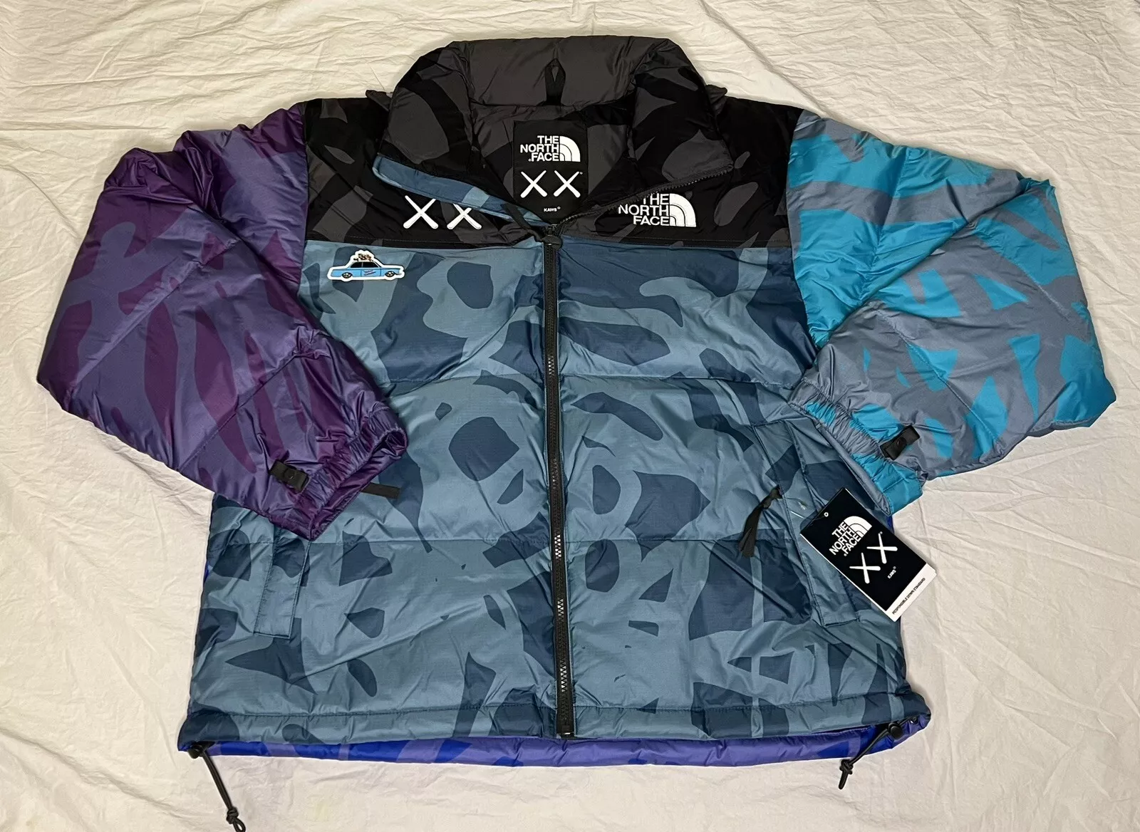 NOUVELLE VESTE DE NUPTSE KAWS X The North Face Retro 1996 Monterey bleu LRG Supreme
