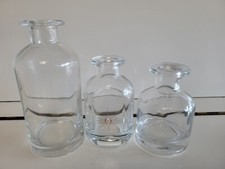 3 CLEAR THICK GLASS DECORATIVE BOTTLES 4 4.25 AND 6 INCHES TALL 1 WITH STARBURST