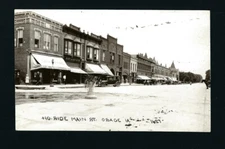 Osage Iowa IA c1920 RPPC Main Street Corner Drug, Bert Day, Bakery, Cafe, Autos