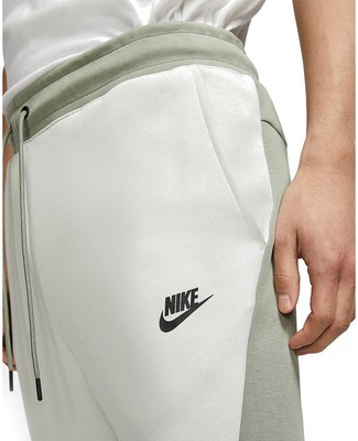 green and white nike tech