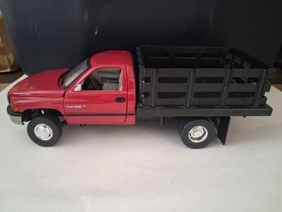 1/18  SCALE   DODGE RAM 3500 DUALLY STAKE TRUCK IN  RED / BLACK BY ANSON