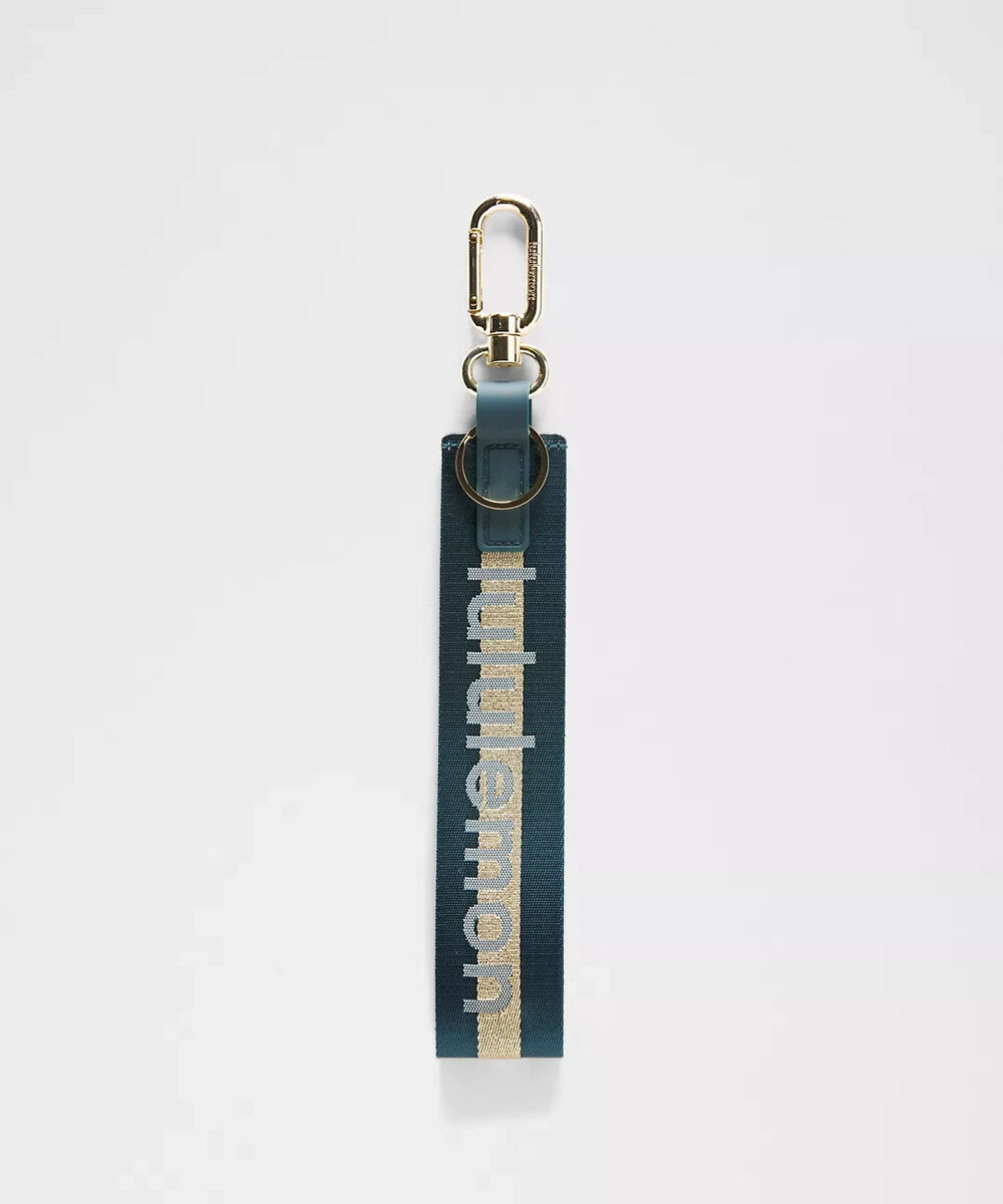 Lululemon Never Lost Keychain Wordmark Warp Teal Gold Bone Lululemon Never Lost Keychain Wordmark Warp Teal Gold Bone