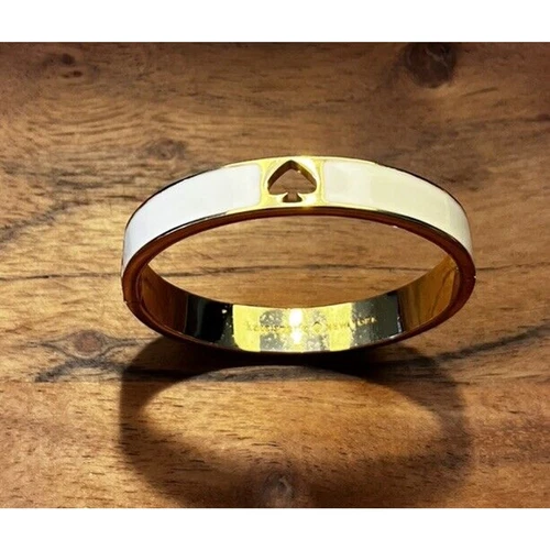 OFF WHITE Bracciale Kate Spade tono oro smalto bianco sporco cerniera timbrato