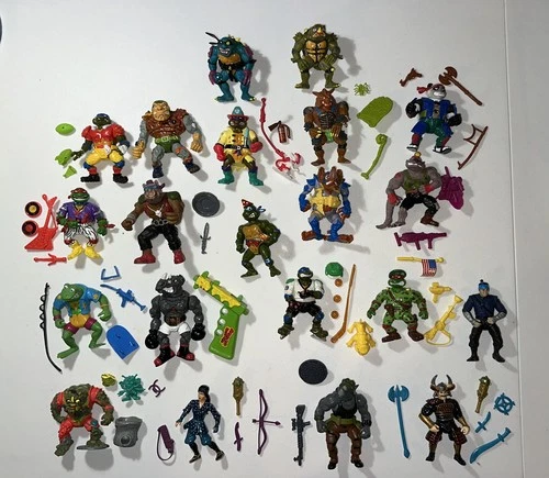 Vintage TMNT Lot – 21 Figures + Weapons 1988–1995