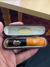 tres jolie ancien fume cigarette en bakelite ambre or ?